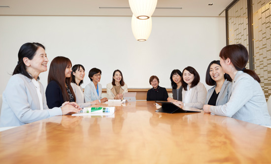 Photo: Women chatting around a table